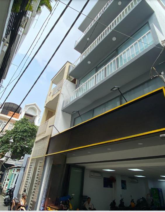 Bán tòa nhà VP 2MT trước sau Q.Phú Nhuận. DT 7x16,5m, 5 tầng (thang máy). Giá 23,5 tỷ